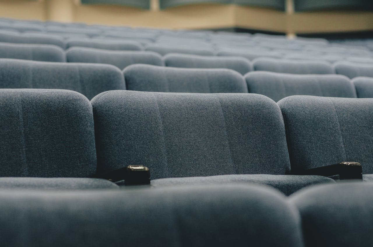 zzzServices Close-up view of empty auditorium seats, perfect for conference or event themes.